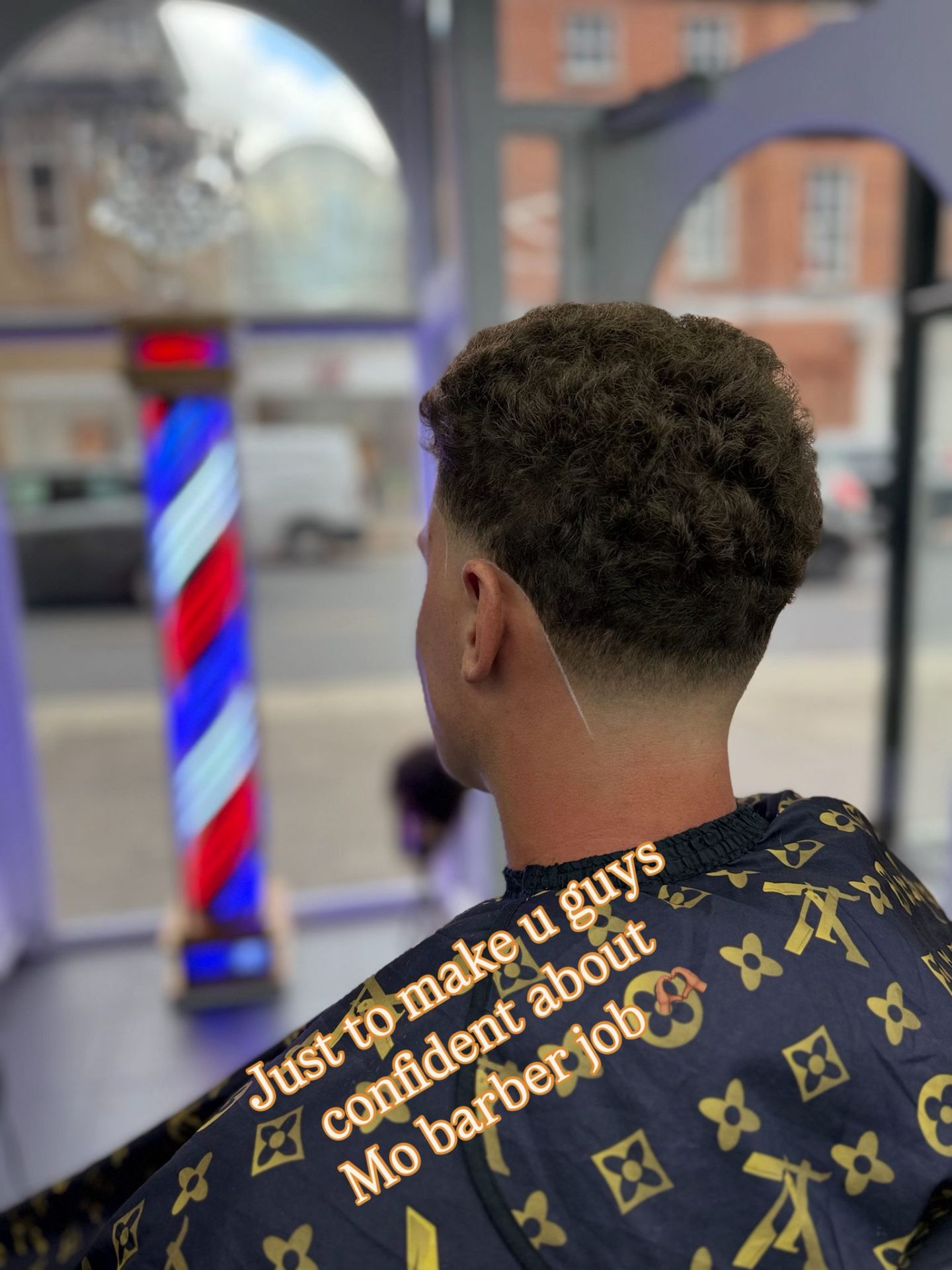 Curly Tapers haircut at MO BARBER
